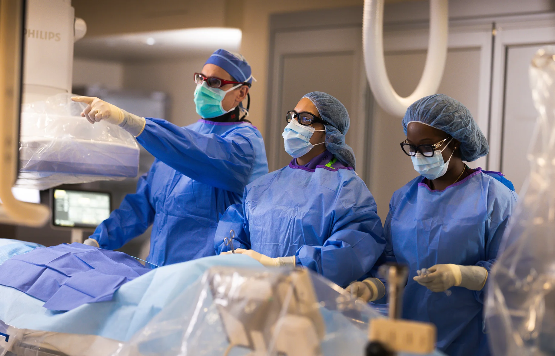 FIU residents learning in an operating room