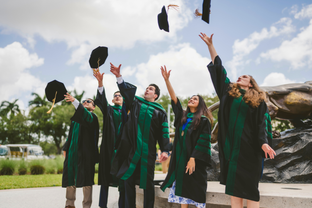 2025 FIU Med graduates toss their caps in celebration after their Commencement Ceremony