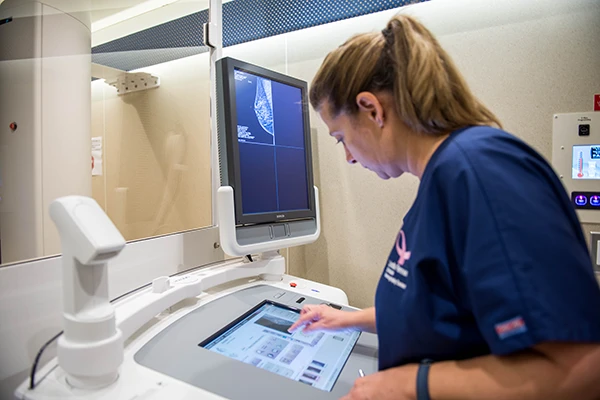 Technician doing breast ultrasound