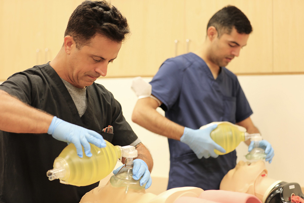 FIU resident examines a dummy