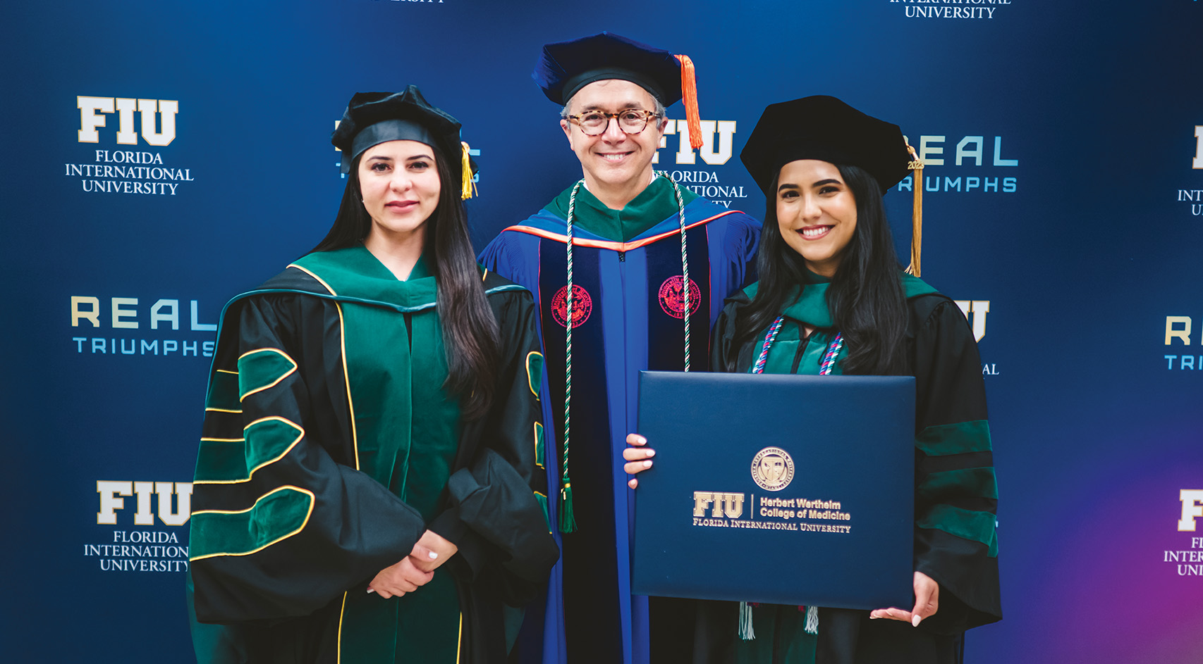 Dean Juan C. Cendan, M.D., is flanked by the college’s first and 1000th graduates–Dr. Hanadys Ale (left) and Dr. Jessie Limonta.