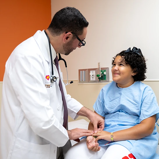 Dr. David Kalfa with a patient