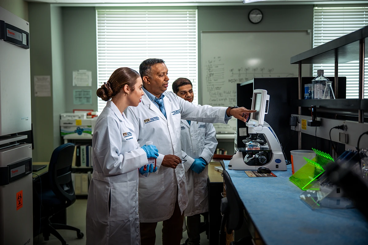 Dr. Aggarwal with students in the lab