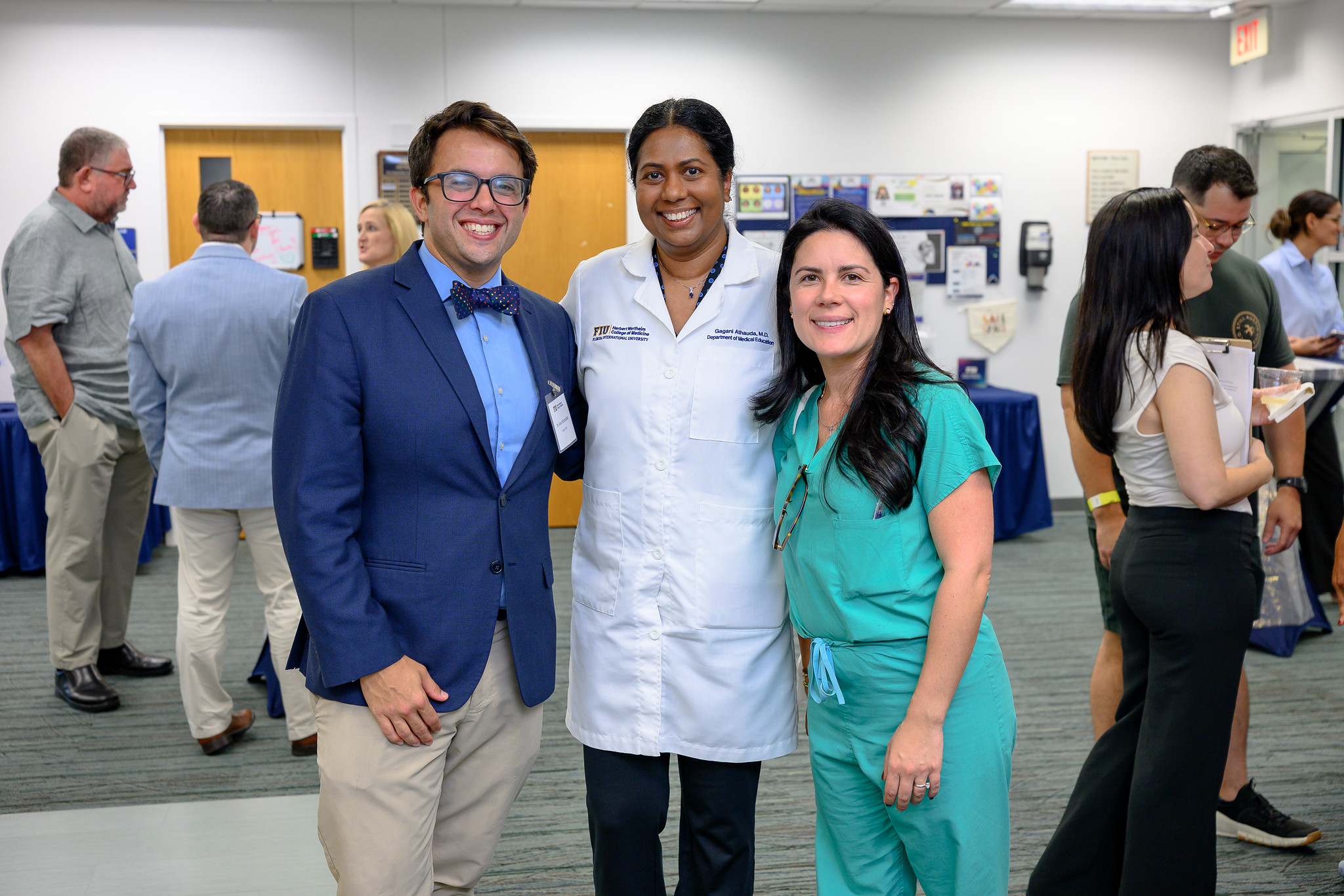 Two MD Class of 2016 alums with Dr. Gagani Athauda at the reunion.