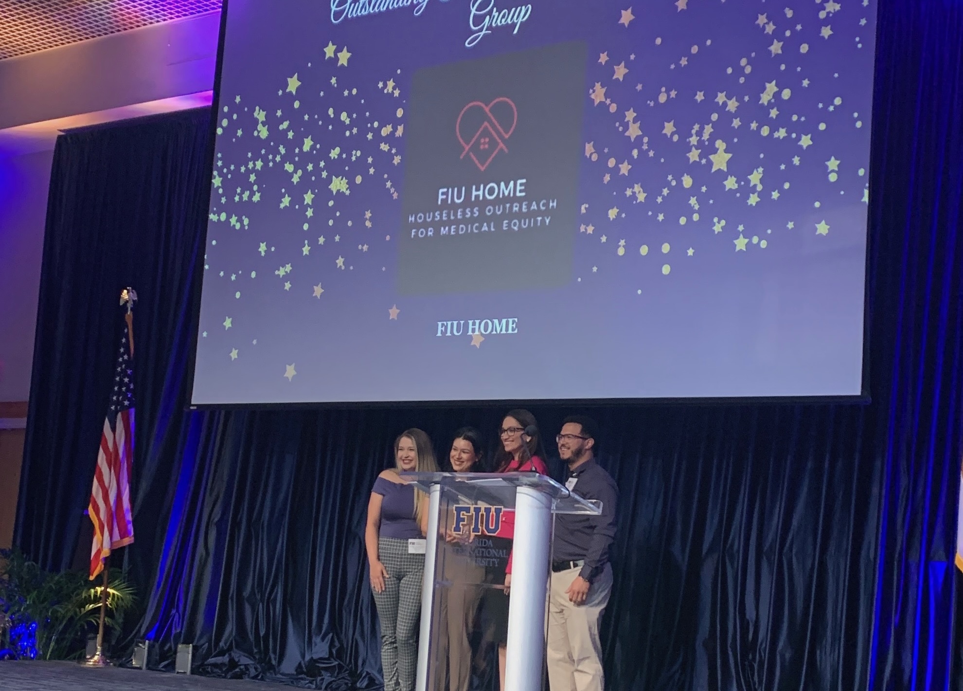 FIU HOME student leaders accept award at the ceremony.